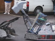 The Steel Avenger fighting Chaos 2 armed with a giant novelty hammer at Oundle Mill in 2001