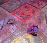 Heavy Metal loses drive on one wheel, but goes through as Foxic is turned over by the Floor Flipper