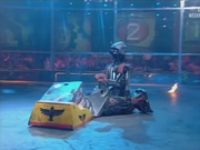 Refbot forces Knightmare and Plunderbird 4 apart. Note that his head is backwards.