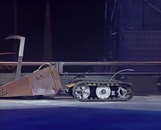 Panzer continues to move Undertaker around the arena