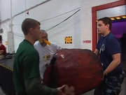 Lee Chenery and Oliver Browne carry Torque of the Devil into the arena for the battle with Bodyhammer