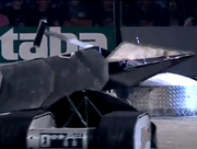 DooAll makes a charge towards Snake and frenZy as the latter hammers away at Snake