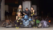 A number of Classic-era House Robots pose with Craig Charles and the RoboBabes during the 2001 Live Event tour
