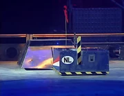 Techno-Lease slowly rams Promethus into the side wall