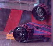 Heavy Metal's wheel is sent out of the arena