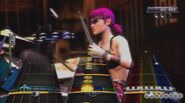 Dora playing drums in Rock Band 3.