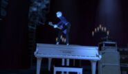 Penny Twilight standing on a piano.