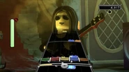 Maynard Winter playing bass in Lego Rock Band.
