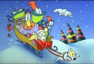 Heffer in a sled with Rocko, Filburt, the Bigheads, and Little Elf