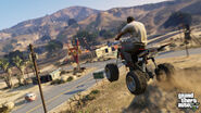 Trevor riding his Quad up a hill in Blaine County.