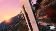 Trevor climbing the Vinewood Sign with the LSPD hot on his trail.