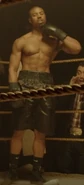 Adonis Creed wearing black trunks during one of his fights in Tijuana, Mexico, seen in Creed.