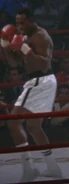 Union Cane wearing black and white trunks in his title defense against Tommy Gunn, seen in Rocky V.