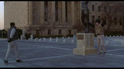 Rocky runs up the steps with Tommy Gunn