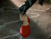  holding the Dipped Toon Shoe