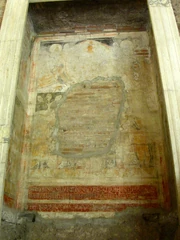 Damaged fresco in a niche.