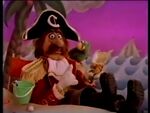 Captain Crook with his green parrot Matey.