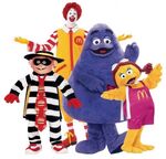 Birdie appears on the right of this image, together with the Hamburglar (left), Ronald McDonald (center), and Grimace (right).