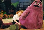 Patti Saunders portraying Grimace.