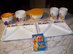 A set of trays and cups featuring McDonaldland characters (with bonus cassette of "That's My Ronald")