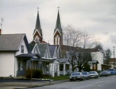 The local church poking over the houses