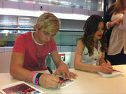 Raura signing autographs