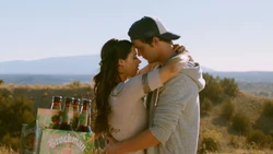 Max and Liz dance together in the desert.