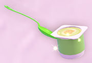 A container of key lime yogurt and a spoon.