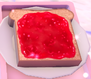 An image of strawberry jam on toast.