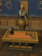 A statue and altar to Apmeken, a desert goddess.