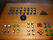 A disassembled Rubik's Revenge, showing all the pieces and central ball.