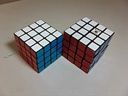 An Eastsheen cube is on the left, and an official Rubik's Revenge is on the right.