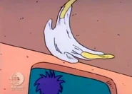 As soon as Stu leaves, Tommy takes off his diaper and tosses it out of the playpen