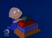 ...building a tower from them the way Chuckie taught him