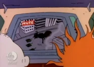 Stu mutes the TV