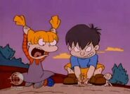 ...then he takes Angelica's Cynthia doll and buries it in the sand