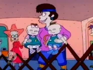 Betty sets Phil and Lil down in the playpen