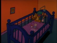 Tommy hallucinates about his crib expanding...