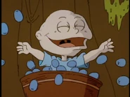 Tommy plays with the grape eyeballs