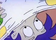 Stu tapes Tommy's diaper back onto his bottom