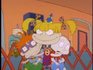 Angelica wants her picture taken with Tommy and Chuckie