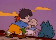 The Bully pushes Tommy down...