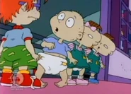 Tommy, Phil, and Lil all stare in shock at Chuckie