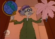 ...but when he picks them up, they're actually a globe and a feather duster