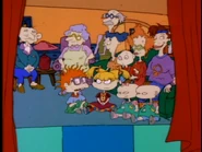 Stu begins his puppet show.