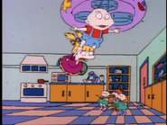 Angelica tries to hang onto Tommy...