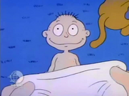 Stu tries to put Tommy's diaper back on a second time