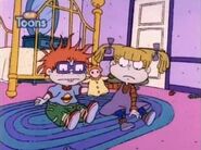 Angelica decides to hide her and Chuckie's hands in a puppet