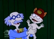 Tommy puts Lou's wombat hat on his head