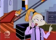Charlotte is on the phone with Jonathan, unaware that Angelica has just snuck past her